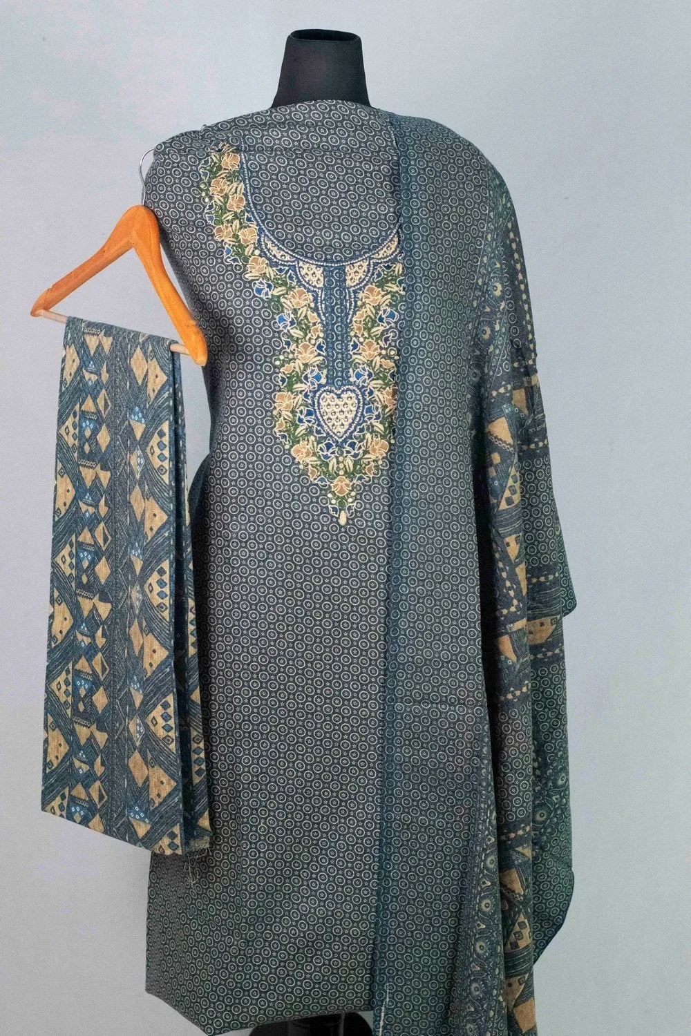 Blue Colour Woolen Kani Printed Suit With Neck And Over All Magical Print Provide Elegance.